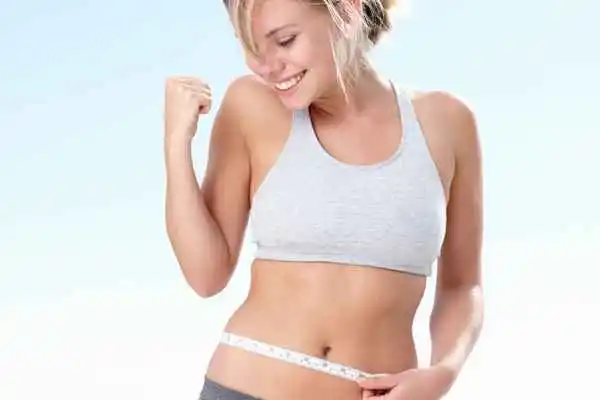 woman happy after fat reduction treatment Rhyl