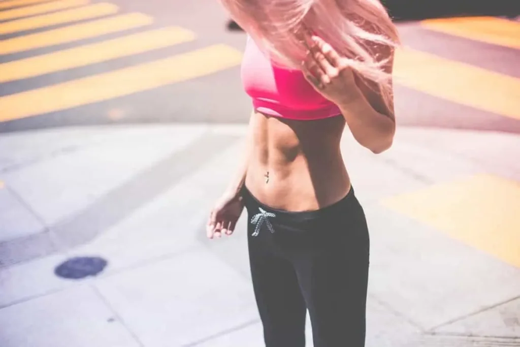 Woman with toned stomach after LA-EMS Body Sculpting Treatment Rhyl