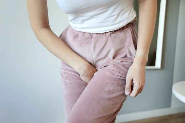 woman running for the toilet because of urinary incontinence Rhyl